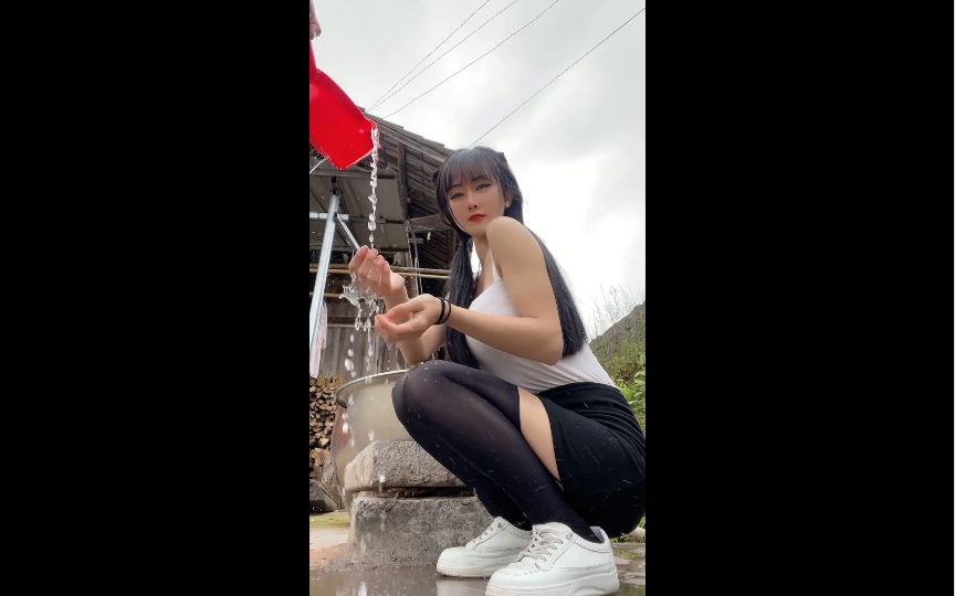 Black silk teases, knee-length skirt displays deadly charm