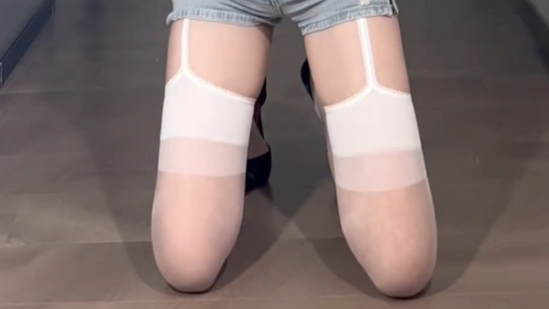 Crossdressing also involves garter belts and white stockings.