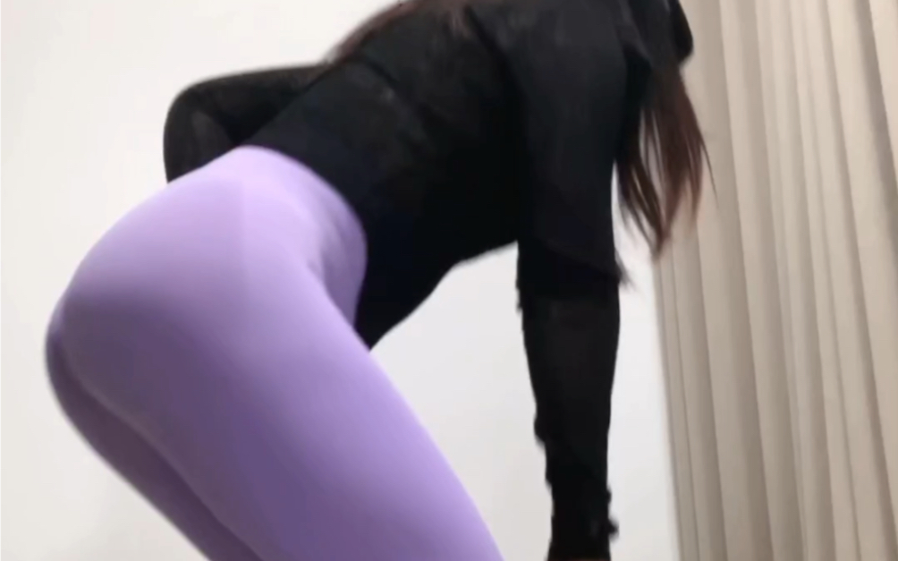 Purple peach butt yoga pants for evening yoga workouts at home.