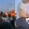 女子坐男子脖子上看升旗仪式现场，引周围游客不满：真的太不礼貌