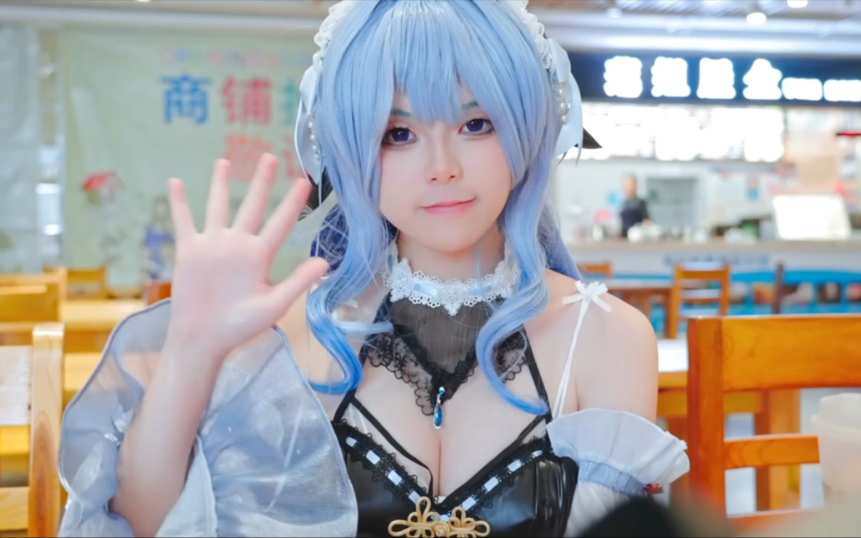 Young lady cosplaying the role of the original god