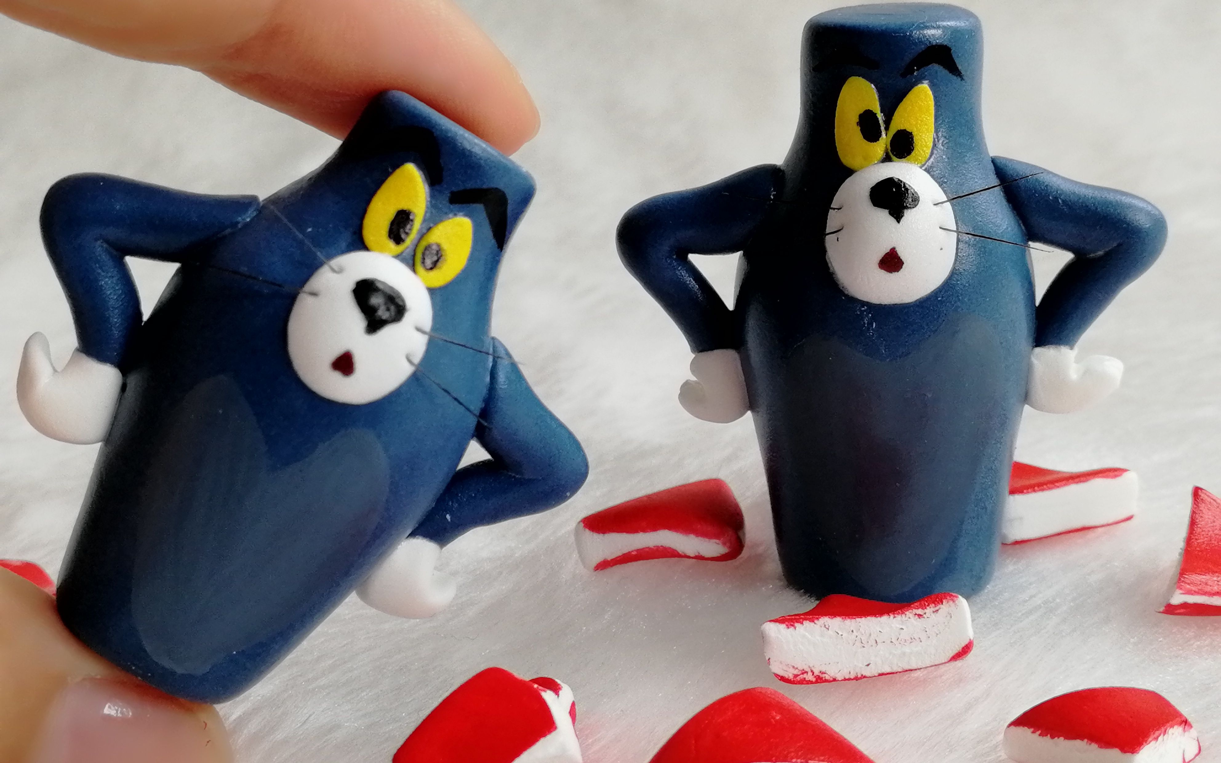 超轻粘土猫和老鼠手心里的沙雕模型汤姆猫