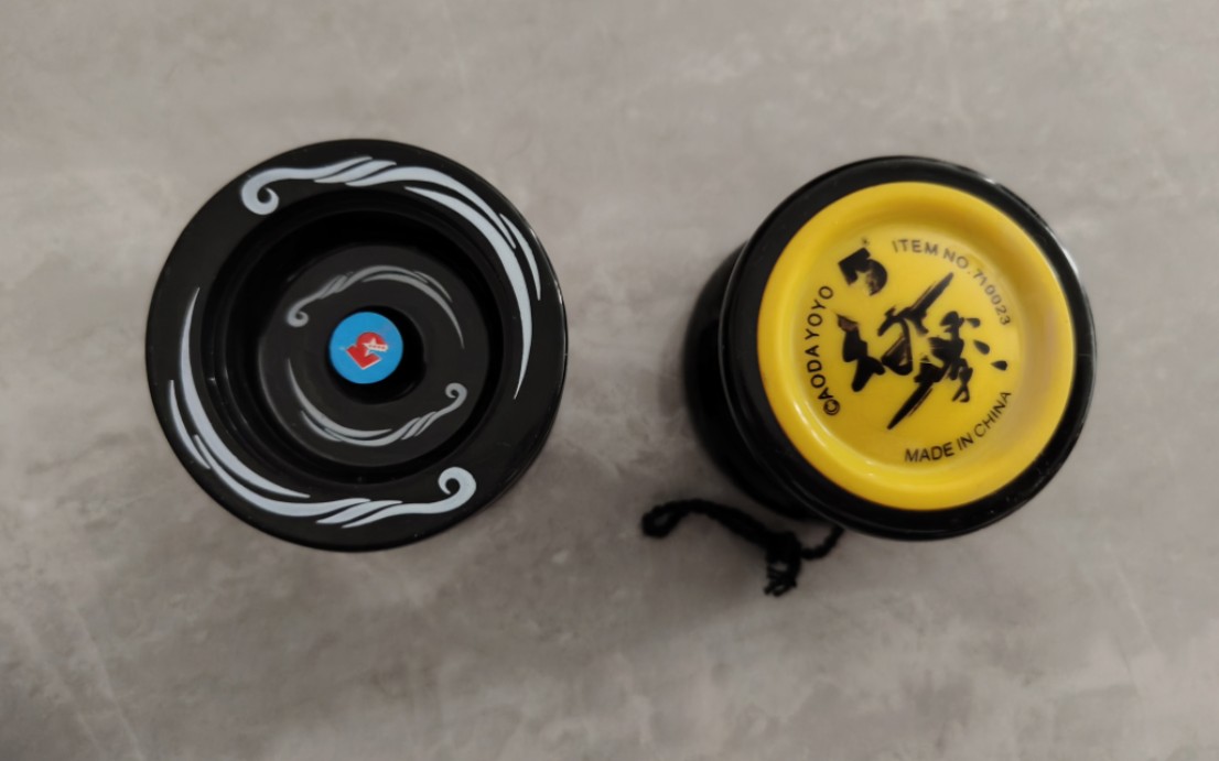 奥达悠悠球 两颗不知道叫啥的球 一个没有字 一个看不懂 请大佬解答一