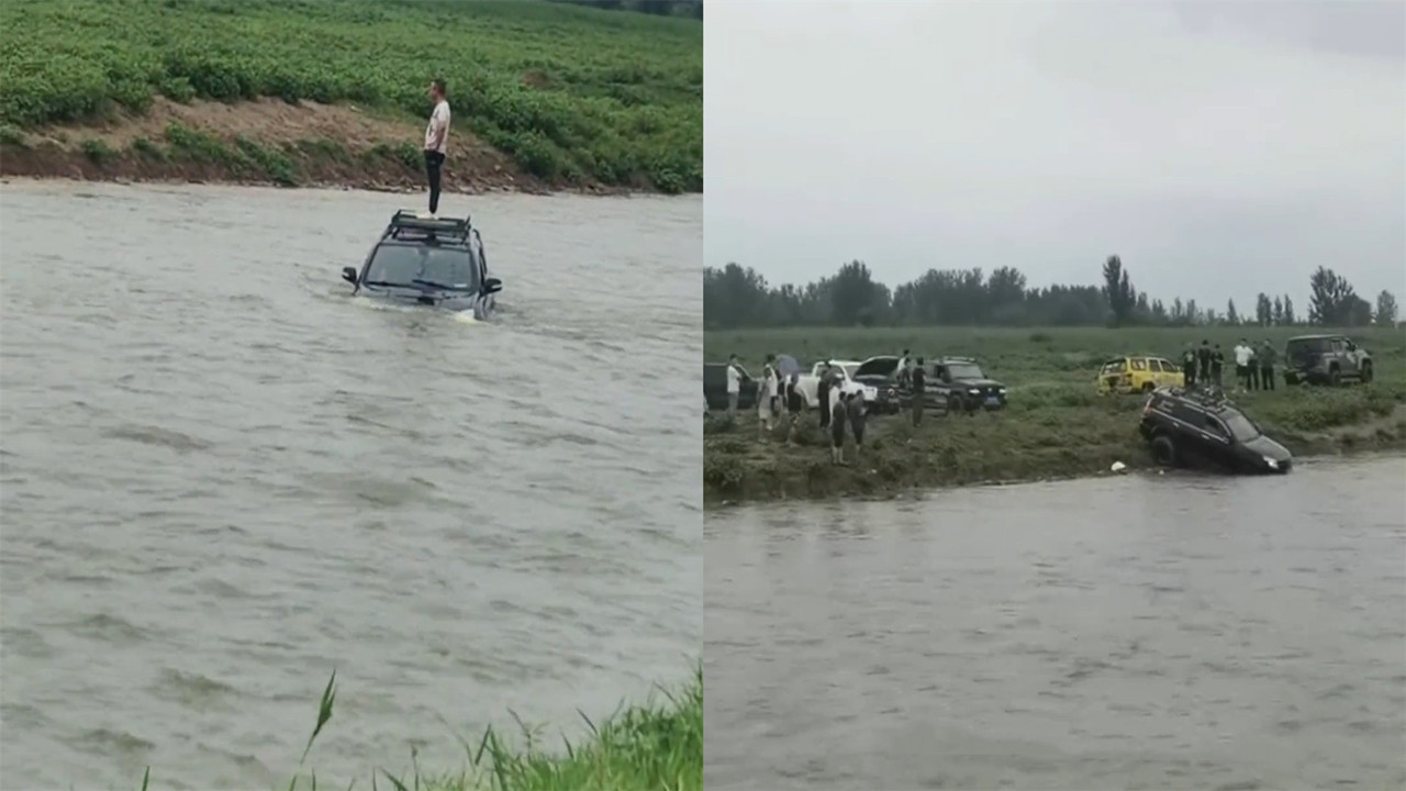 [图]男子暴雨后强行开车渡河，连人带车被冲走，围观群众将其拉上岸