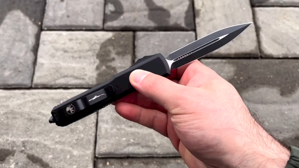 microtech美国微技术直跳 正面g10 双刃ut 背面铝柄 m390刃 黑色涂层