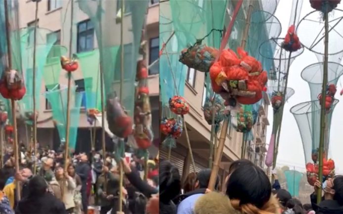 浙江一居民乔迁高空抛礼,引数百名村民高举自制网兜,站楼下抢接哔哩哔哩bilibili