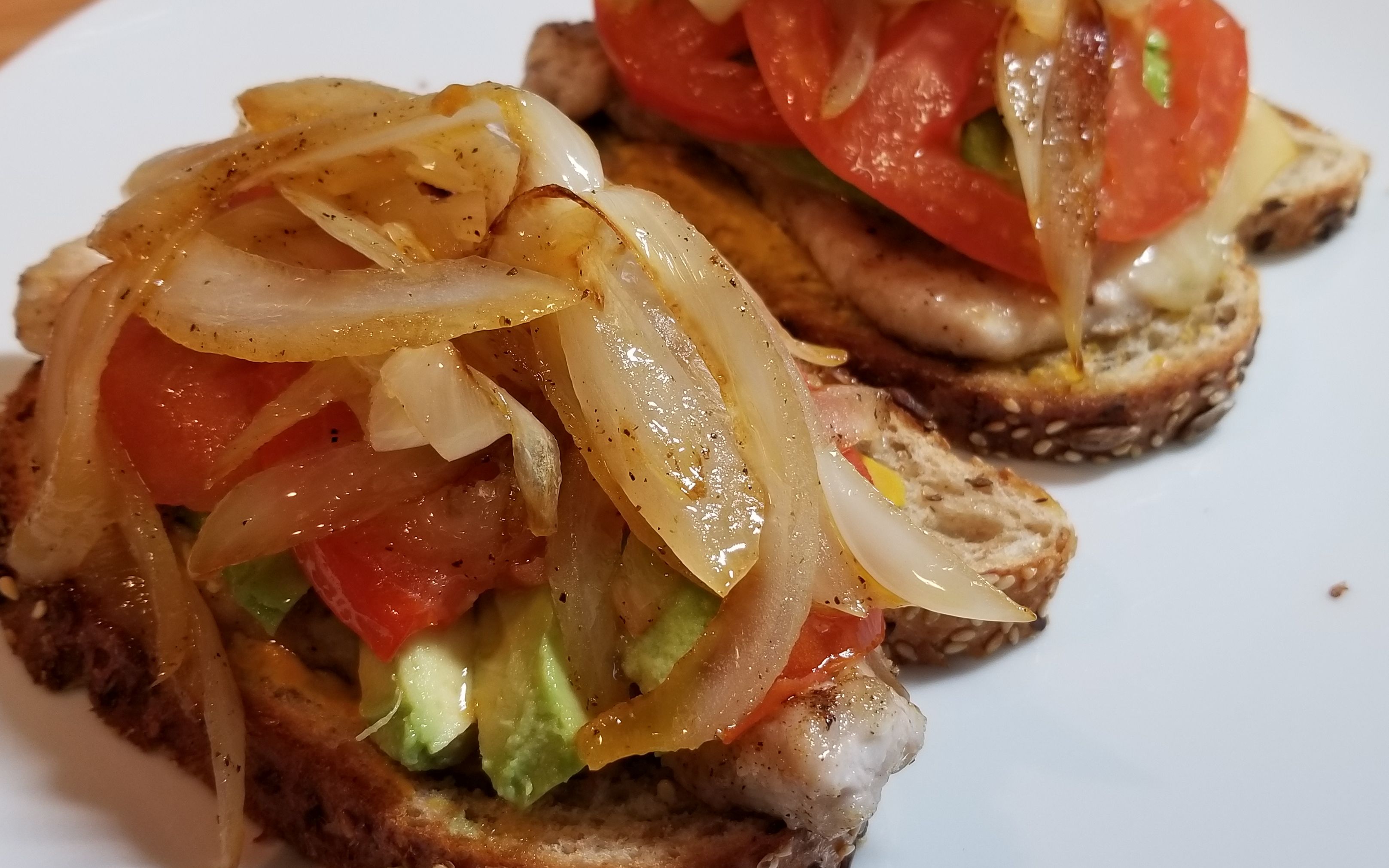 open faced pork loin avocado sandwich with smoked cheddar cheese