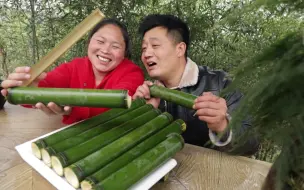 Descargar video: 胖妹做腊肉竹筒饭，8根竹筒先蒸后烤，夫妻俩大吃一顿，真过瘾